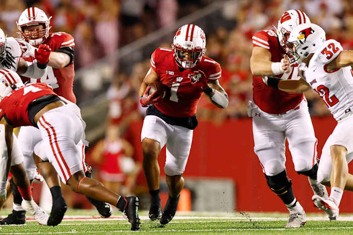 Wisconsin running back Chez Mellusi running through an open hole in the Illinois State defense